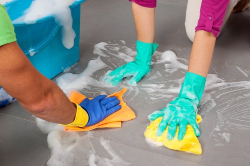 Technician preparing carpet cleaning equipment with safety focus